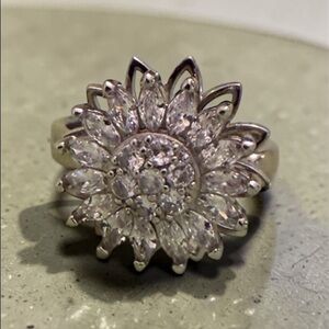 Moissanite spinner adjustable flower ring.